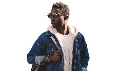 Portrait of stylish young african man model wearing denim jacket isolated on a white backgroundの写真素材