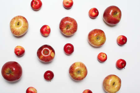 Many different scattered apples isolated on a white backgroundの写真素材