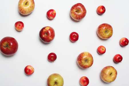 Many different scattered apples isolated on a white backgroundの写真素材