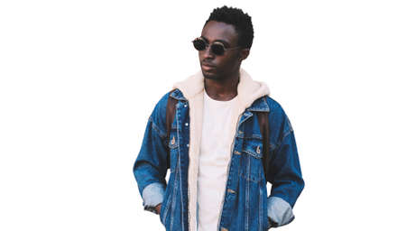 Portrait of stylish young african man model wearing denim jacket isolated on a white backgroundの写真素材