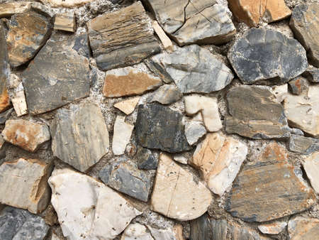Old ancient wall with different stones as abstract backgroundの写真素材