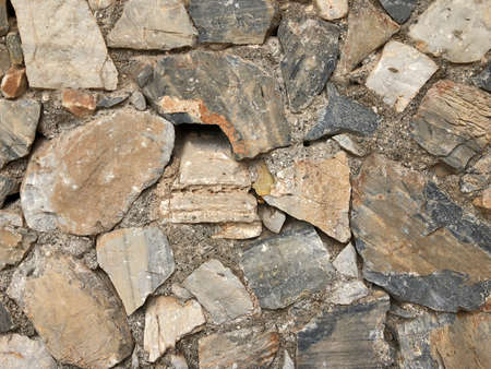 Old ancient wall with different stones as abstract backgroundの写真素材