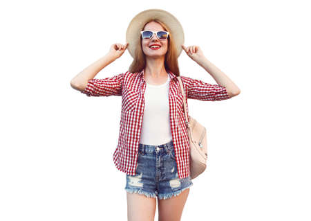 Portrait of young woman wearing summer straw hat, checkered shirt, shorts isolated on white backgroundの写真素材