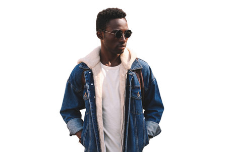Portrait of stylish young african man model wearing denim jacket isolated on white backgroundの写真素材