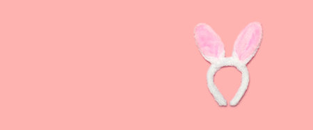 Sweet fluffy bunny ears isolated on pink background, top view, blank copy space for advertising textの写真素材