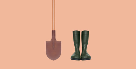 Gardening set tools, rubber boots and shovel isolated on brown background