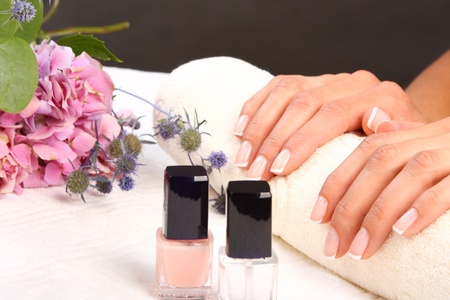 Woman in a nail salon receiving a manicureの写真素材