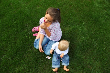 Children in the meadow - familyの写真素材