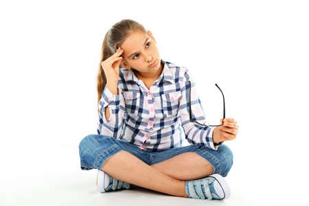 Girl with glasses - isolated on whiteの写真素材