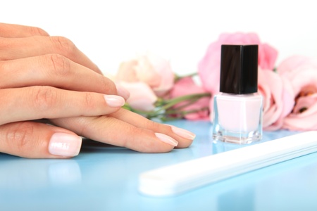 Woman in a nail salon receiving a manicureの写真素材