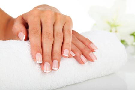 Woman in a nail salon receiving a manicureの写真素材
