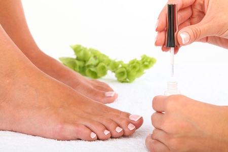 Beauty treatment photo of nice pedicured feetの写真素材