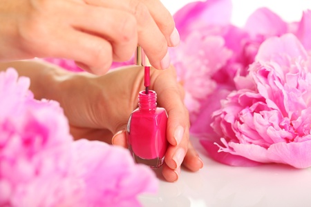 Woman in a nail salon receiving a manicureの写真素材