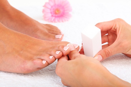 Beauty treatment photo of nice pedicured feetの写真素材