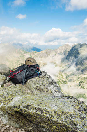 Helmet, backpack and trekking polesの写真素材