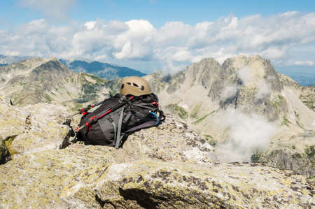 Helmet, backpack and trekking polesの写真素材