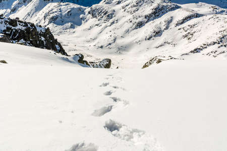 Valley in the mountains is all in the snowの写真素材