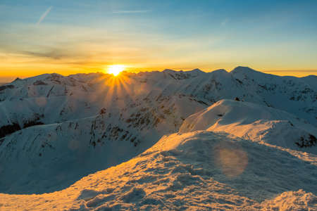 Winter sunrise over the ridge in the Tatrasの写真素材