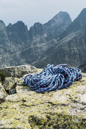 Blue line on boulders with peaks in the backgroundの写真素材