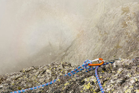 Self-arrest with rope on a anchor in the mountains