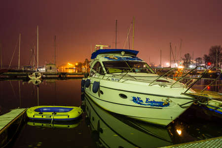 Szczecin, Poland - October 30, 2015 - Motor boat and pontoon moored to the jetty after sunset on the Dabie Lake in Polandのeditorial素材