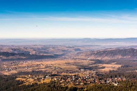Balloon flies over the valley and the city