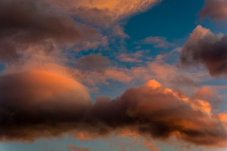 Clouds in the color of the setting sun.