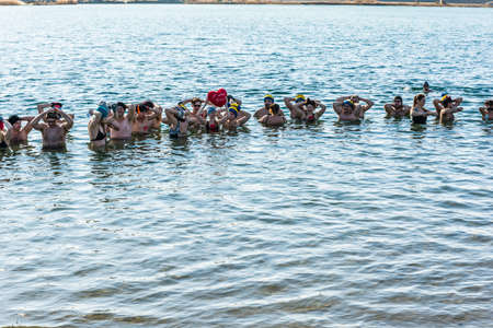 Radlow, Poland - February 14, 2016: Group winter swimming on Valentine's Day in taking a traditional bath.のeditorial素材
