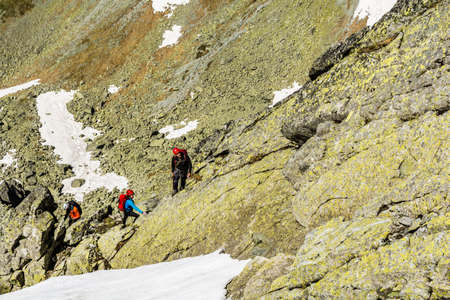 High Tatras, Slovakia - June 18, 2016: Mountain guide with a couple of customers in the mountains (Tatras).のeditorial素材