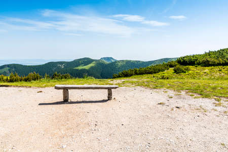 Bench to rest and enjoy the view of the mountains.の写真素材