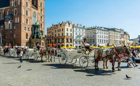 Krakow, Poland - August  26, 2016: Fiacre waiting to transport tourists.のeditorial素材