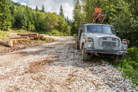 Ziar, Slovakia - September 04, 2016: Old truck transport of timber on the side of the road.のeditorial素材
