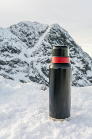 tumbler against peak (Swinica, Svinica) in winter.