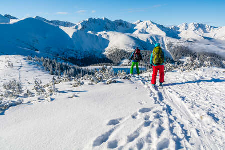 Witow, Poland - February 19, 2017: Two skiers mountain  backpackers descend from the summit.のeditorial素材