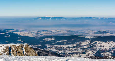 Winter smog seen from the peak in the Tatras, surging over Zakopane and the surrounding villages.の写真素材