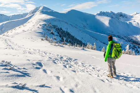 Analysis further down the road by a tourist in winter in the mountains.の写真素材