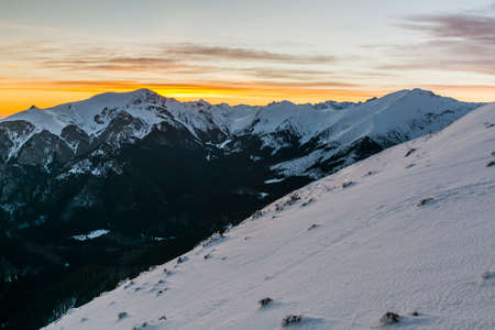 Colorful sky at sunrise in the mountains.の写真素材
