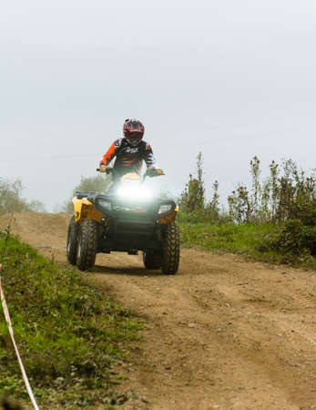 Biskupice Radlowskie, Poland - October 22, 2017: Riding a quad bike on the road.のeditorial素材
