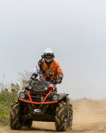 Biskupice Radlowskie, Poland - October 22, 2017: The man riding a leisure quad on the road.
