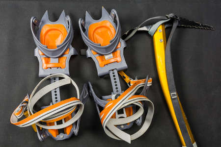 Basic crampons and ice axe for winter hiking on trails.の写真素材