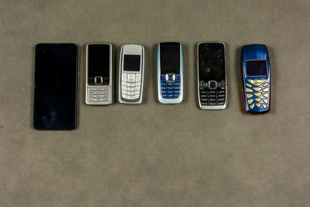Selection of various mobile phones and a smartphone.の写真素材