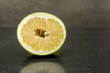 Ripe pulp of fruit pomelo on the table.の写真素材