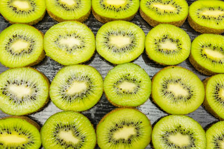 Kiwifruit cut into a pattern or texture or background view from above.の写真素材
