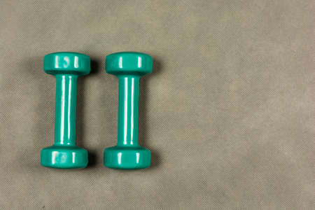 Dumbbells for fitness or rehabilitation weighing two kilograms in green.の写真素材