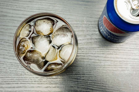 Niedomice, Poland - December 22, 2017: Top view of ice cubes in a glass with Pepsi.のeditorial素材