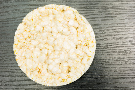 Rice cake on a dark wooden board.