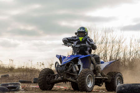 Biskupice Radlowskie, Poland - January 14, 2018: An ATV rider in a helmet and protective clothing.のeditorial素材