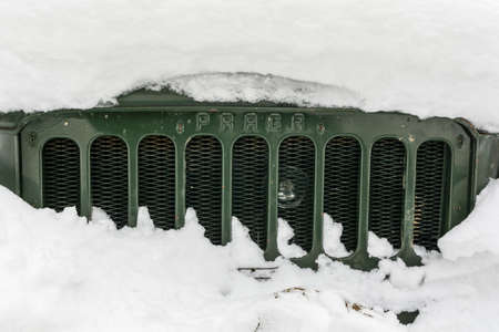 Zdiar, Slovakia - February 11, 2018: Grille of an old truck (Praga V3S) in the snow.のeditorial素材