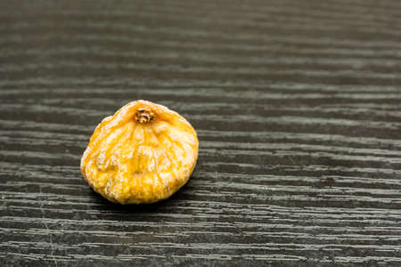 Dried fig fruit on a wooden dark basis.の写真素材