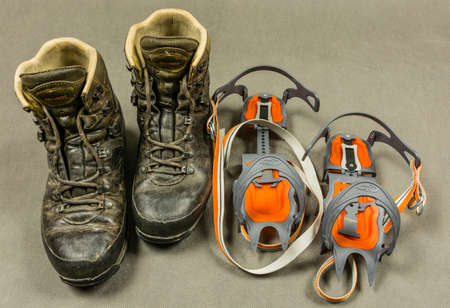 Niedomice, Poland - February 14, 2018: The presentation hiking boots (Meindl Engadin) and classic binding crampons (Climbing technology Nuptse).のeditorial素材